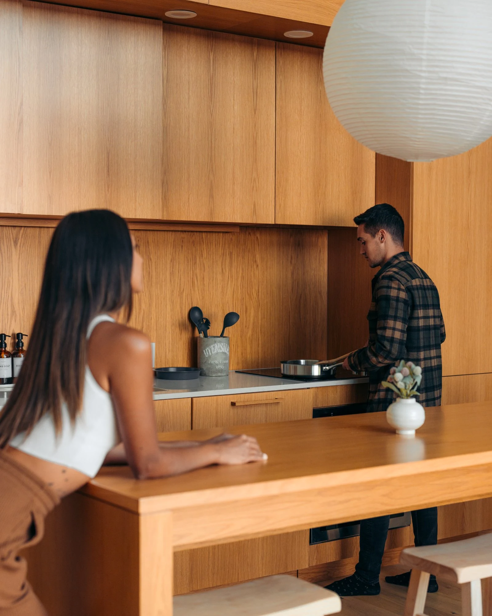 Couple cooking together in kitchen at The A-Frame vacation rental