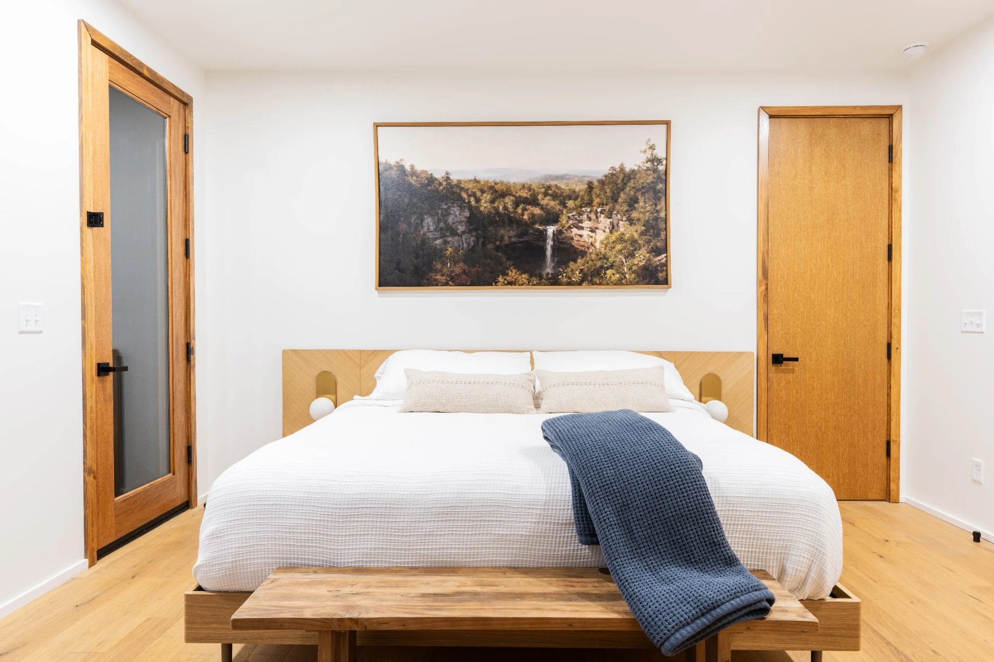 Primary bedroom with oak headboard at Jackson Point Sewanee Tennessee