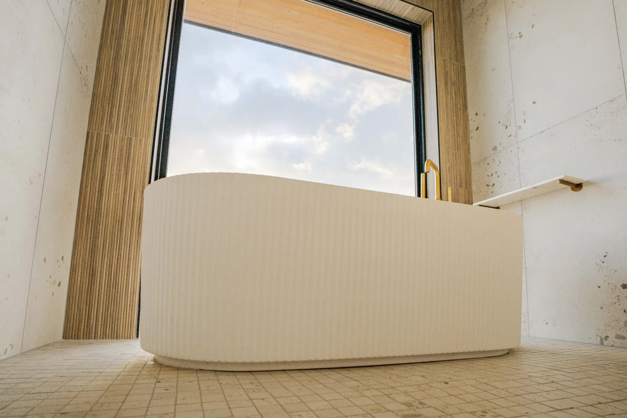 Fluted freestanding tub with valley view window in primary bath at Jackson Point