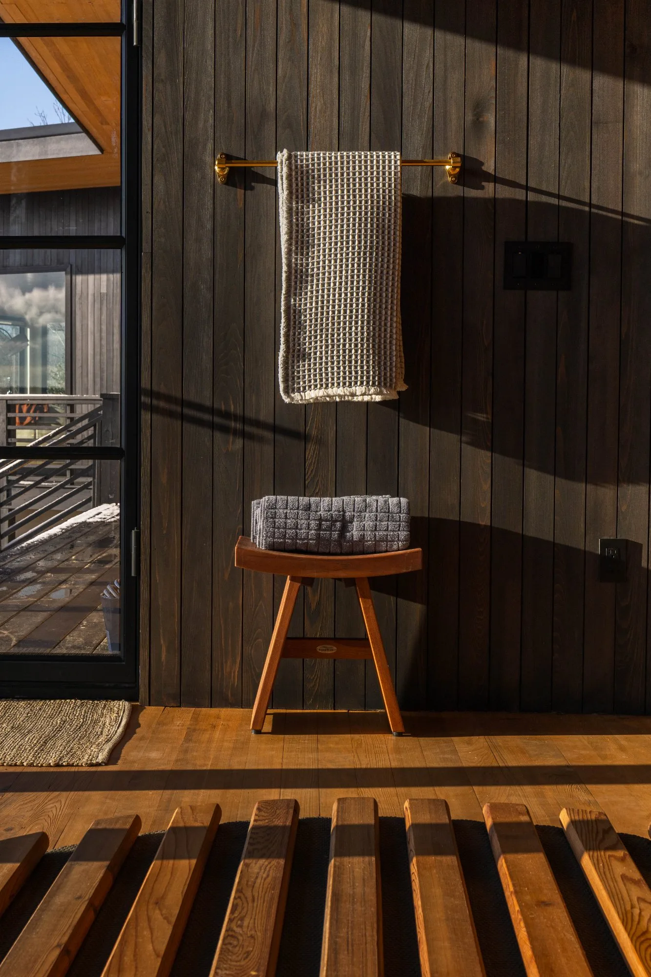 Waffle towels and teak stool in Wellness Room at Jackson Point Sewanee