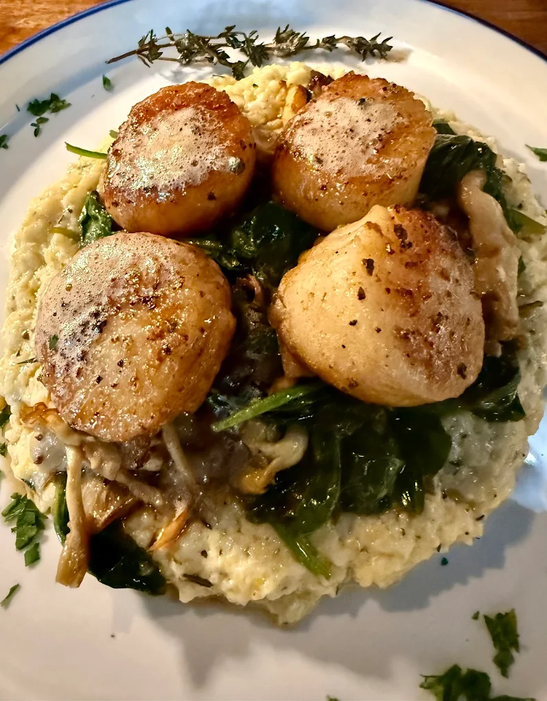 Seared scallops with greens and grits from Mountain Top Restaurant in Monteagle, Tennessee